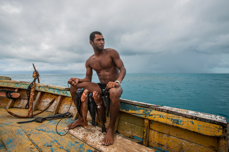 A traditional spear fisherman with is daily catch for his family on the island of Abrolhos, Brazil. This is the southernmost coral reef in the Atlantic and is safeguarded as a Marine Protected Area.